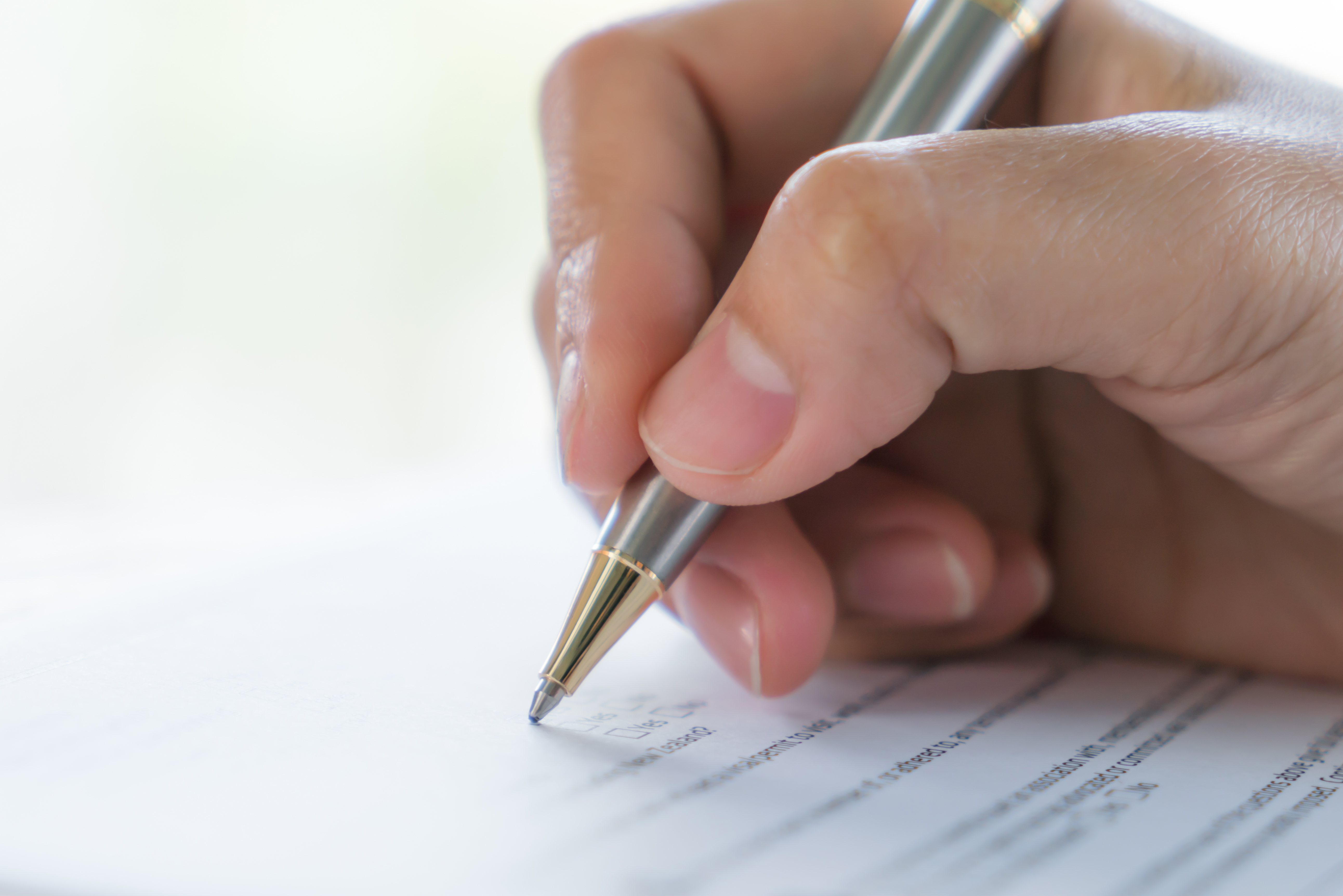 hand-with-pen-application-form