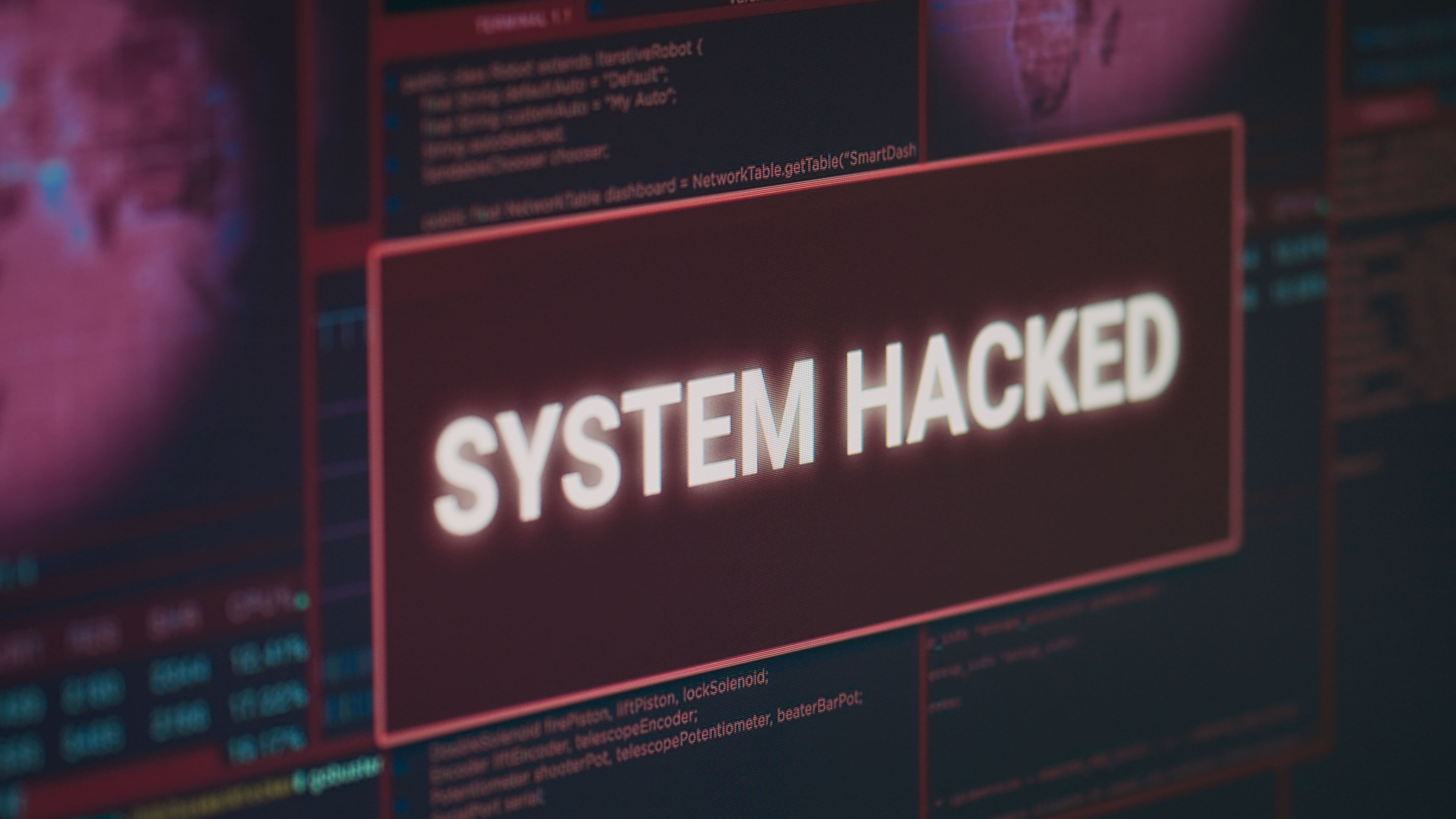 computer-monitor-showing-hacked-system-alert-message-flashing-screen-dealing-with-hacking-cyber-crime-attack-display-with-security-breach-warning-malware-threat-close-up 3